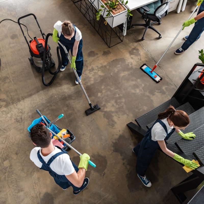 top view of cleaning company team cleaning modern office top view of cleaning company team cleaning modern office
